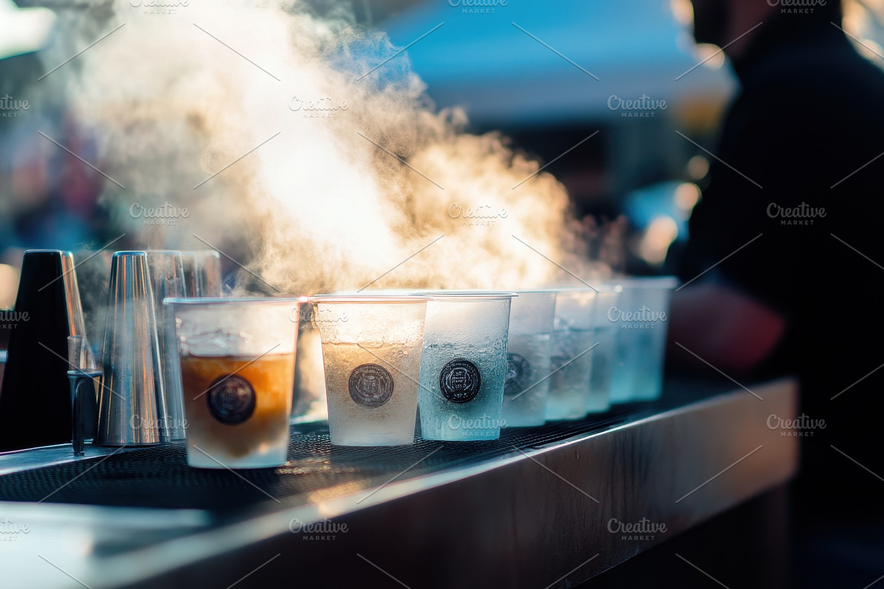 Steaming drinks lined up on a bar co, a Photo by Iftikhar Alam