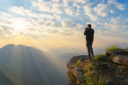 Portrait of Asian man, a photographer tourist holding a camera,, a Person Photo by Tampatra