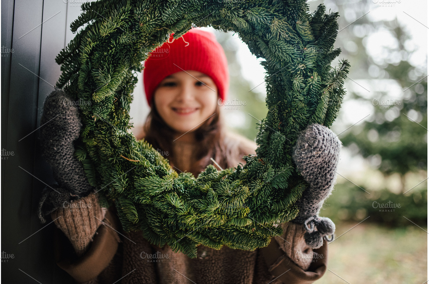 Girl holding a handmade Christmas, a Holiday Photo by HalfPoint