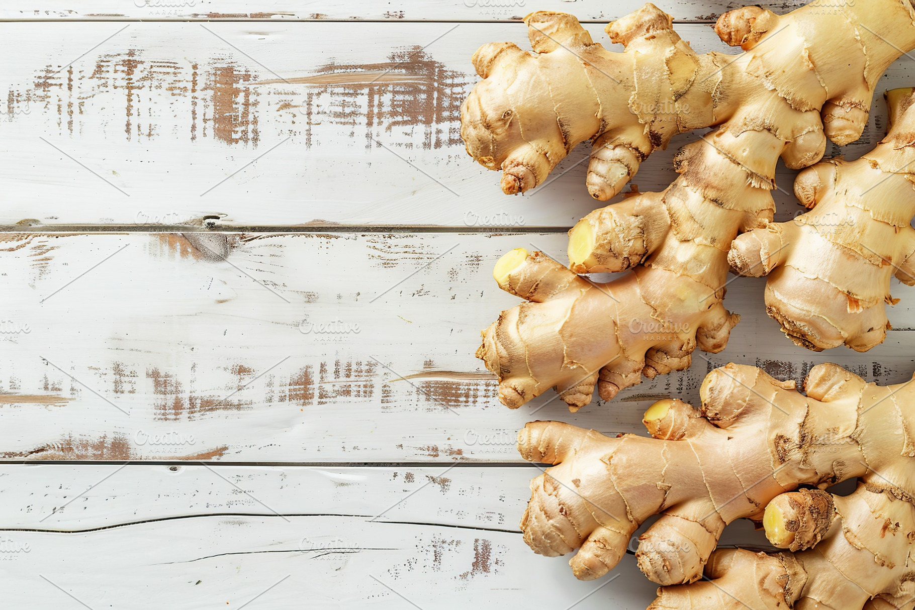 Fresh ginger root on wooden table, a Food & Drink Photo by AlyaAnd