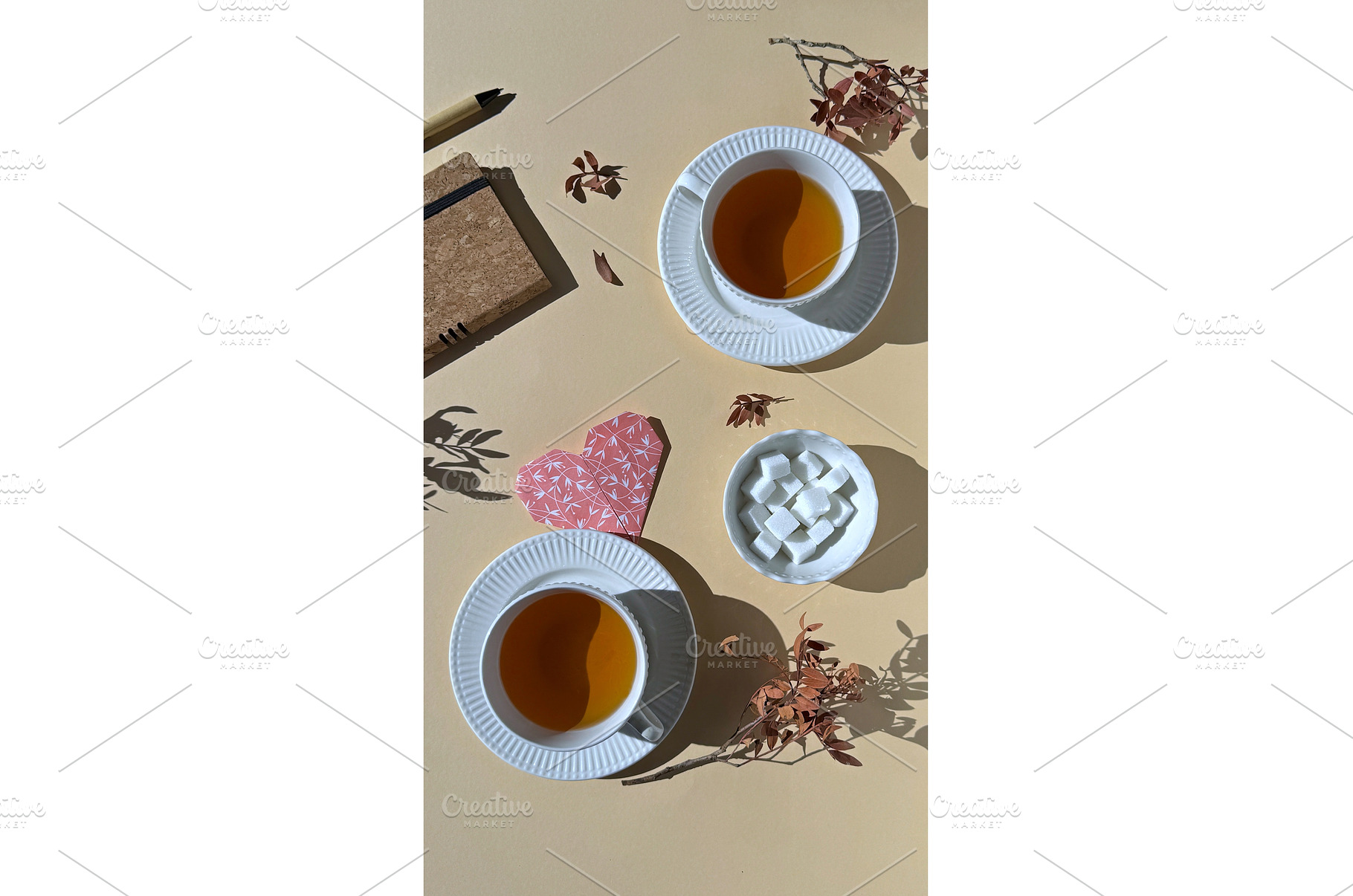Two cups of tea with sugar cubes, a Photo by tilialucida