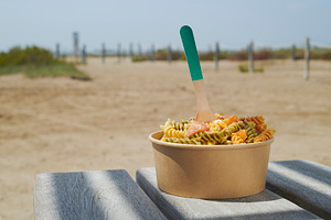 colorful pasta bowl on a summer table, a Photo by Nito