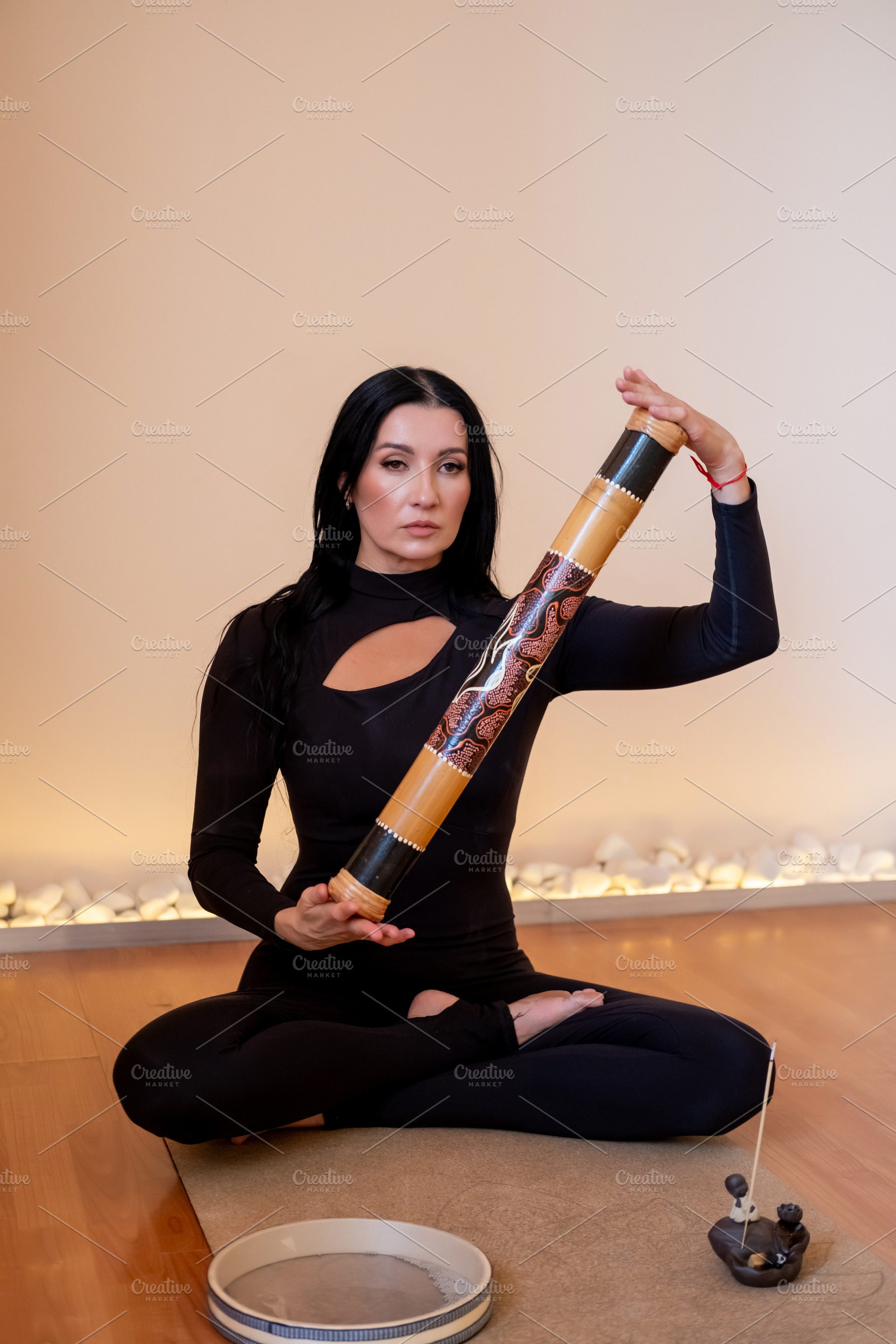 Yoga practice sound healing woman ethnic rainstick, a Person Photo by Photo Drive Studio