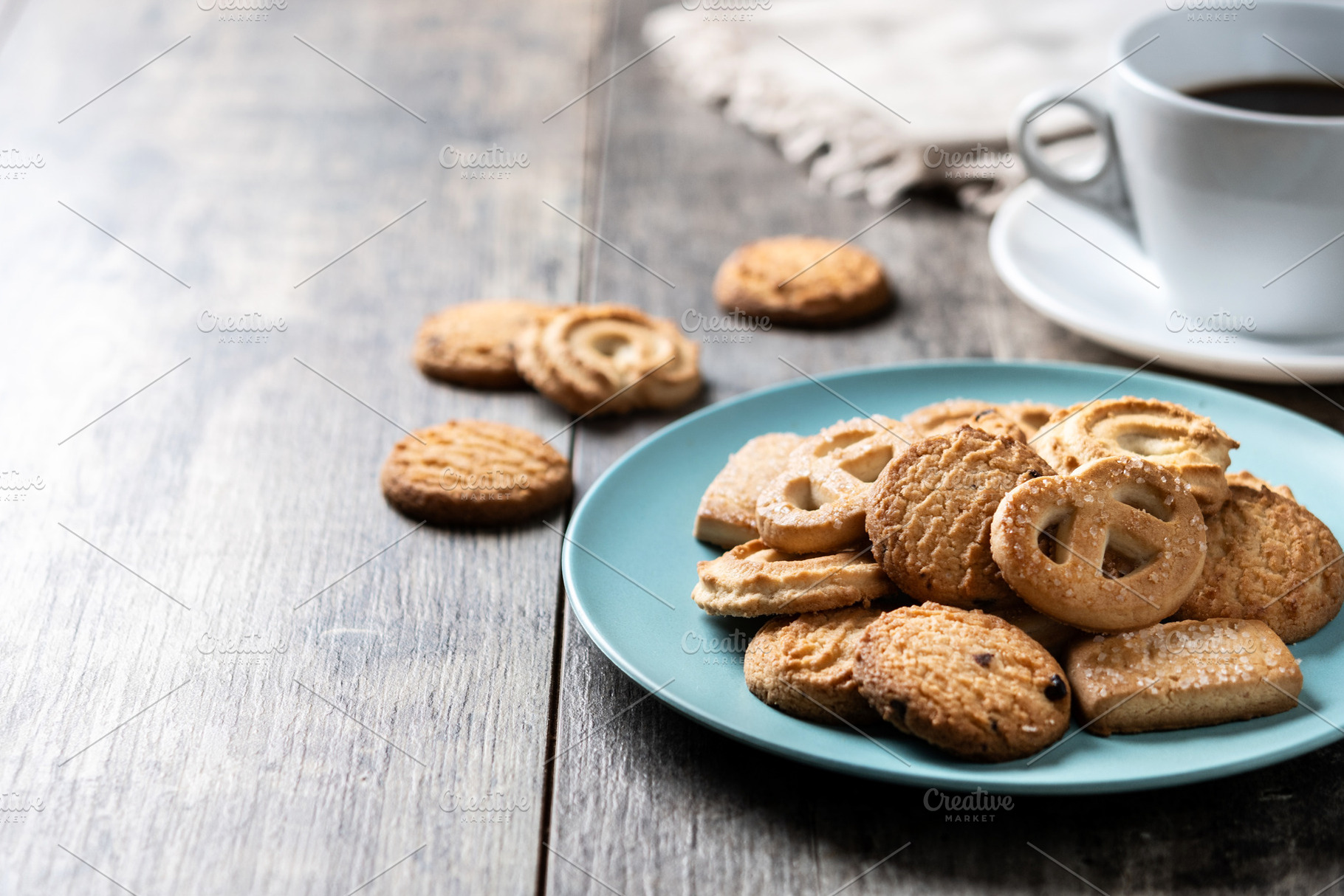 Assorted butter cookies on plate with cup of coffee, a Food & Drink Photo by etorres69