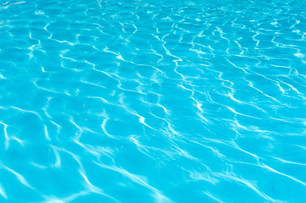 Water surface on swimming pool containing surface, sunlight, and ripples, an Abstract Photo by PranFoto