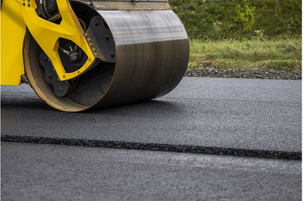 Heavy yellow asphalt road roller, an Industrial Photo by volodymyrshtun13795