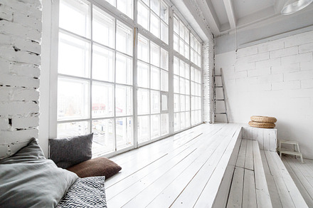 Bright photo studio interior with big window high ceiling white wooden floor, an Architecture Photo by Northern Life