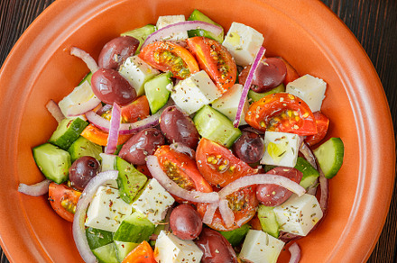 Bowl of Greek salad, a Food & Drink Photo by Alexander Prokopenko