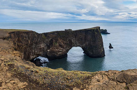 Picturesque autumn evening view to Dyrholaey coast cliffs and ro, a Nature Photo by YuriyB