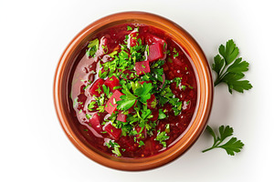 Flat lay of bowl of beet root soup borsch on white background, a Food & Drink Photo by AlyaAnd