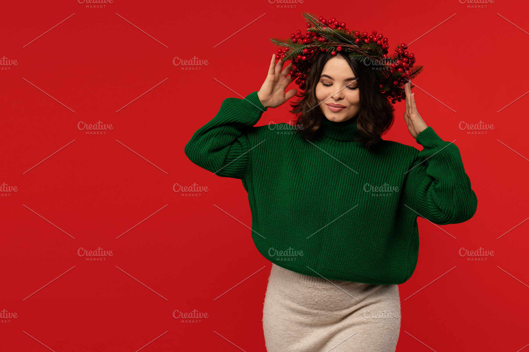 Woman wearing festive wreath of red, a Holiday Photo by Elena Vagengeim