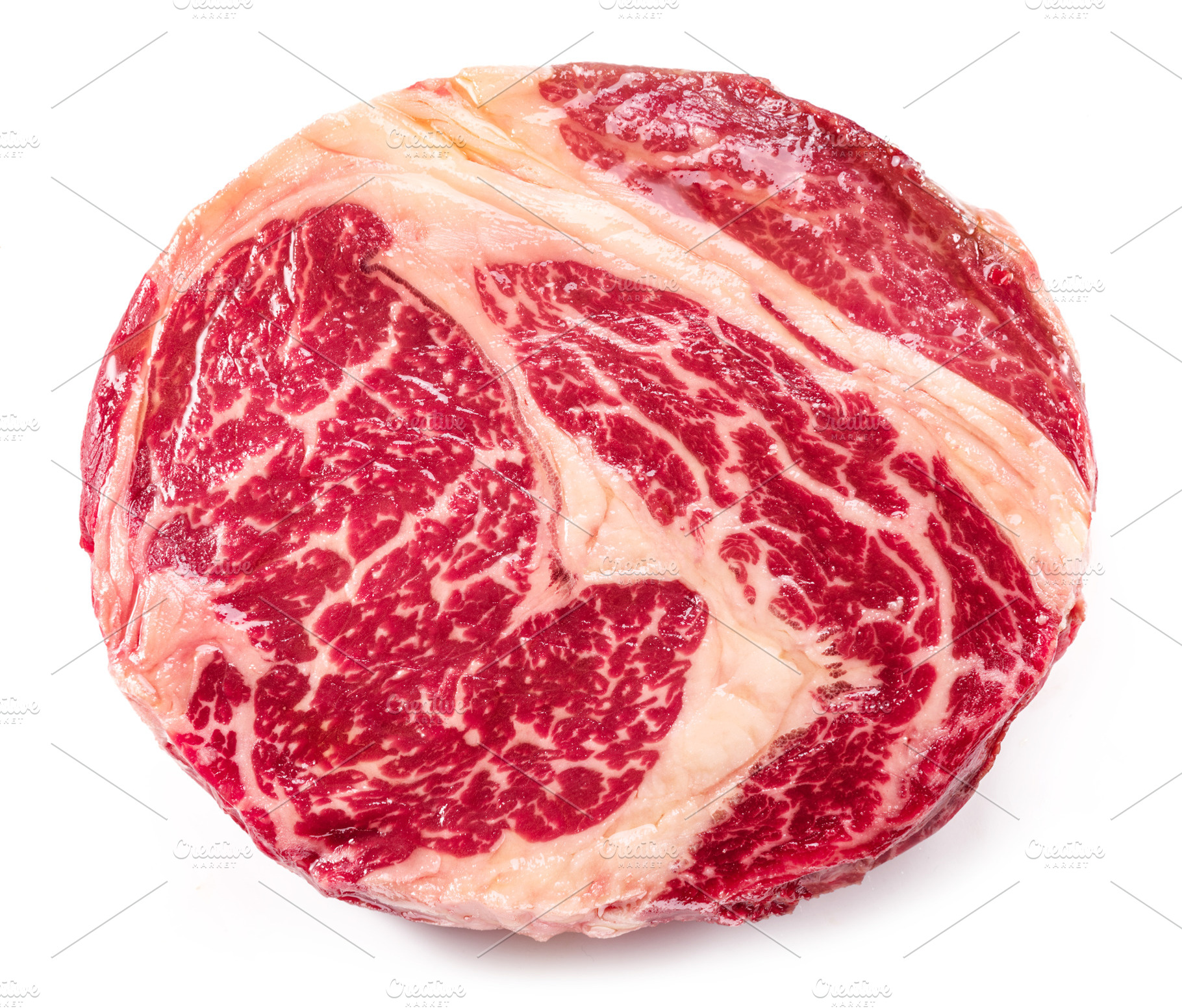 Raw ribeye steak isolated on white background., a Food & Drink Photo by Volff