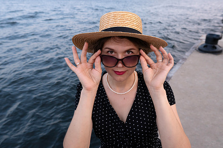 Portrait of woman adjusting sunglass