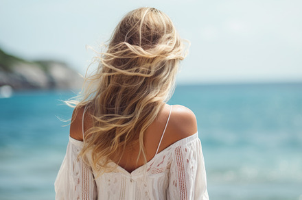 Young woman in summer white dress standing on beach and looking to the sea, a Person Photo by Natalia Klenova's Shop
