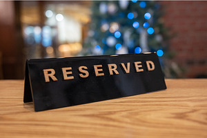 Reserved table sign in festive, a Food & Drink Photo by Jan Jack Russo Media