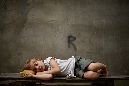 Unfortunate stray kid lying on the featuring child, girl, and homeless
