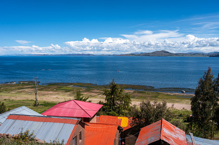 Scenic view of Lake Titicaca from Llachon with rural houses, an Architecture Photo by GoodGoods