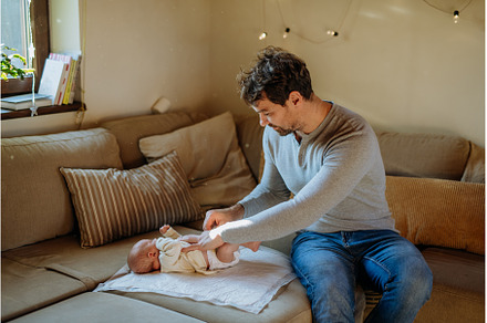 Mature father changing diaper his, a Person Photo by HalfPoint