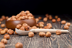 A pile of hazelnuts on the table, a Food & Drink Photo by rsoollAI