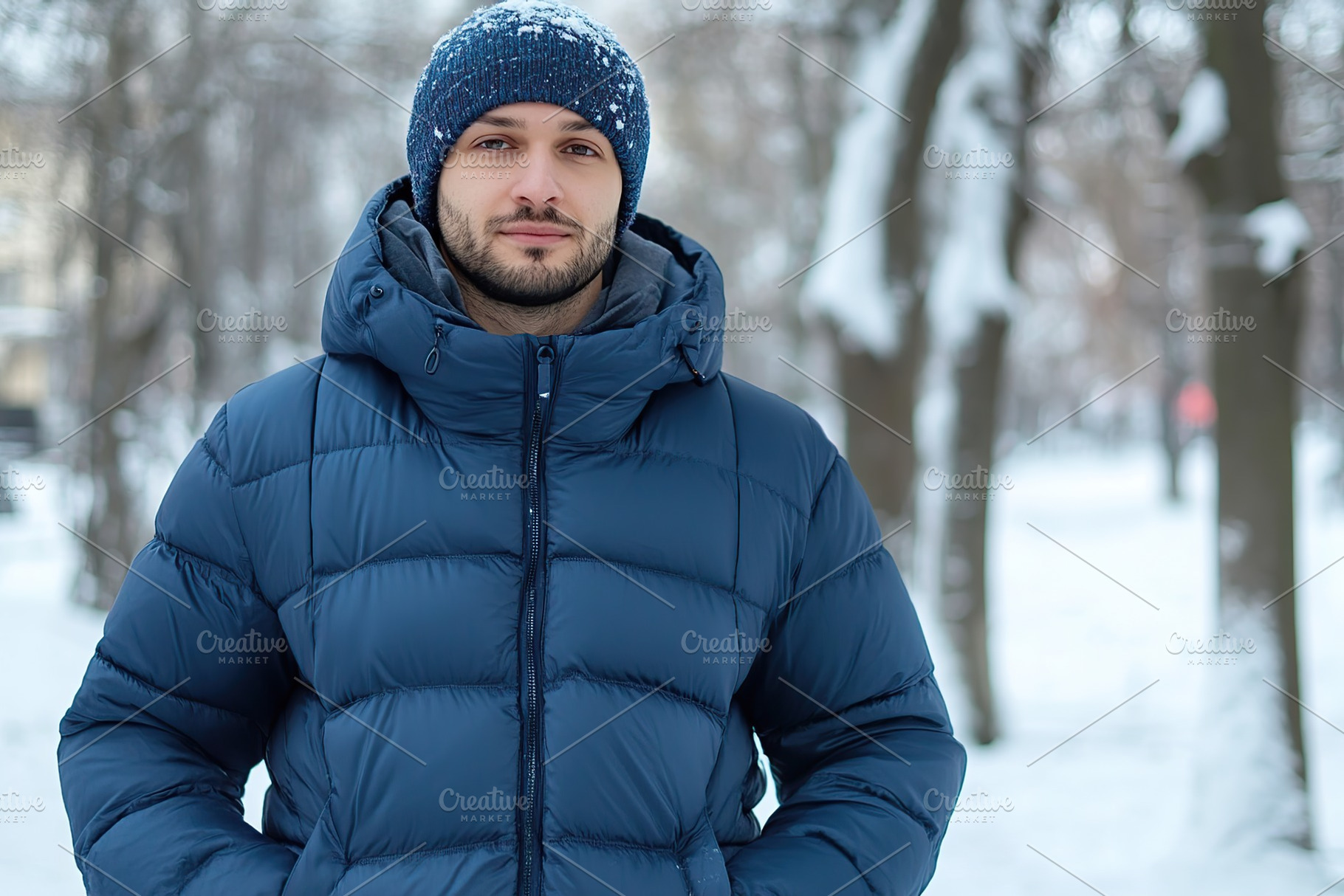 Man in blue puffer jacket in winter time, a Person Photo by AlyaAnd