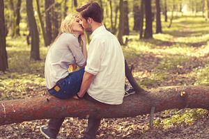 kissing couple in the forest