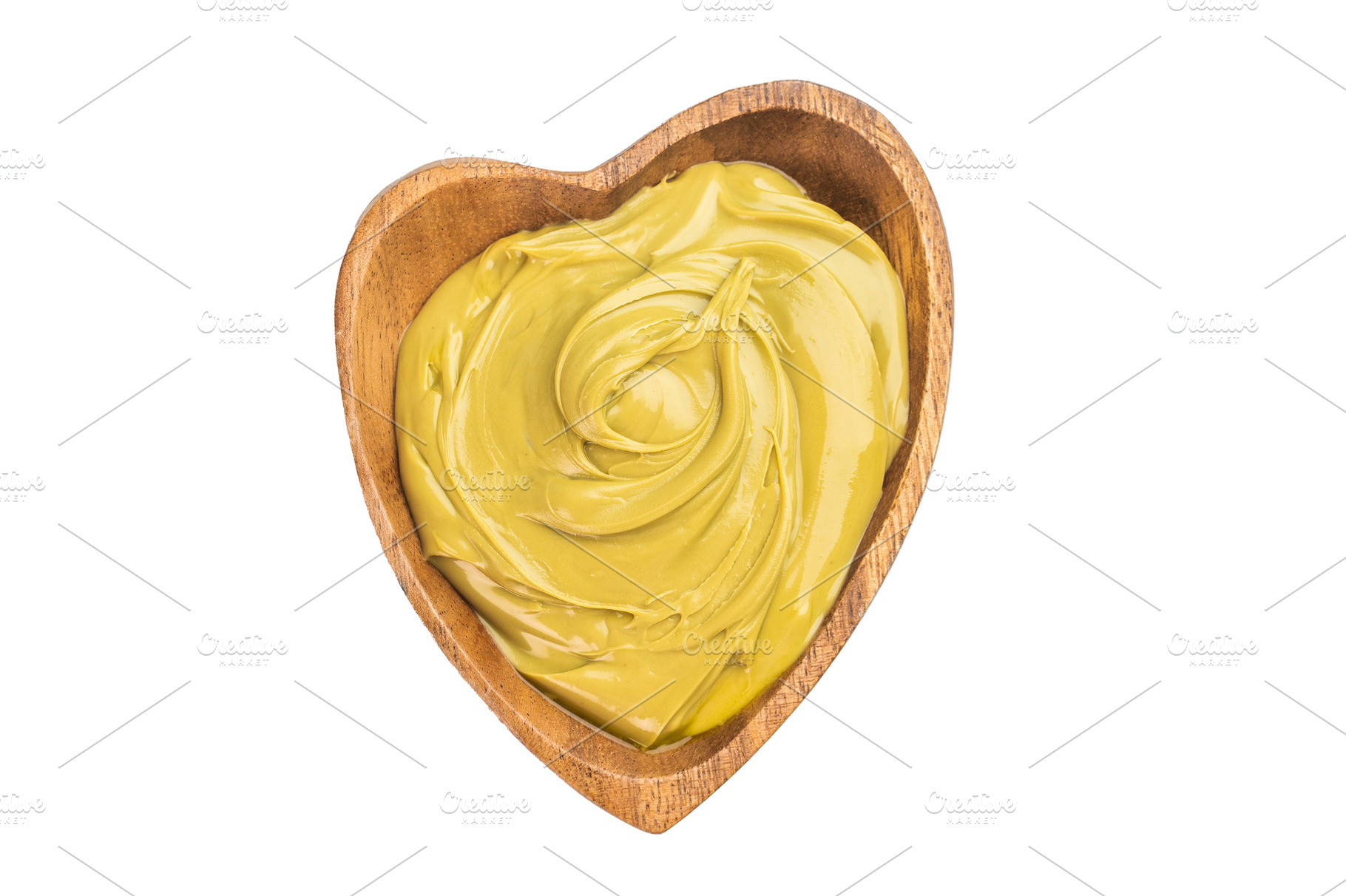 Creamy pistachio paste with smooth glossy texture in wooden hear, a Food & Drink Photo by composter-box@mail.ru