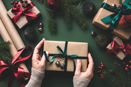 Female hands holding gift box