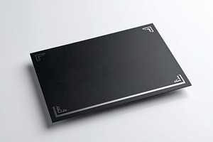 Modern black business card centered on a white desk, a Business Photo by DanFLCreativo