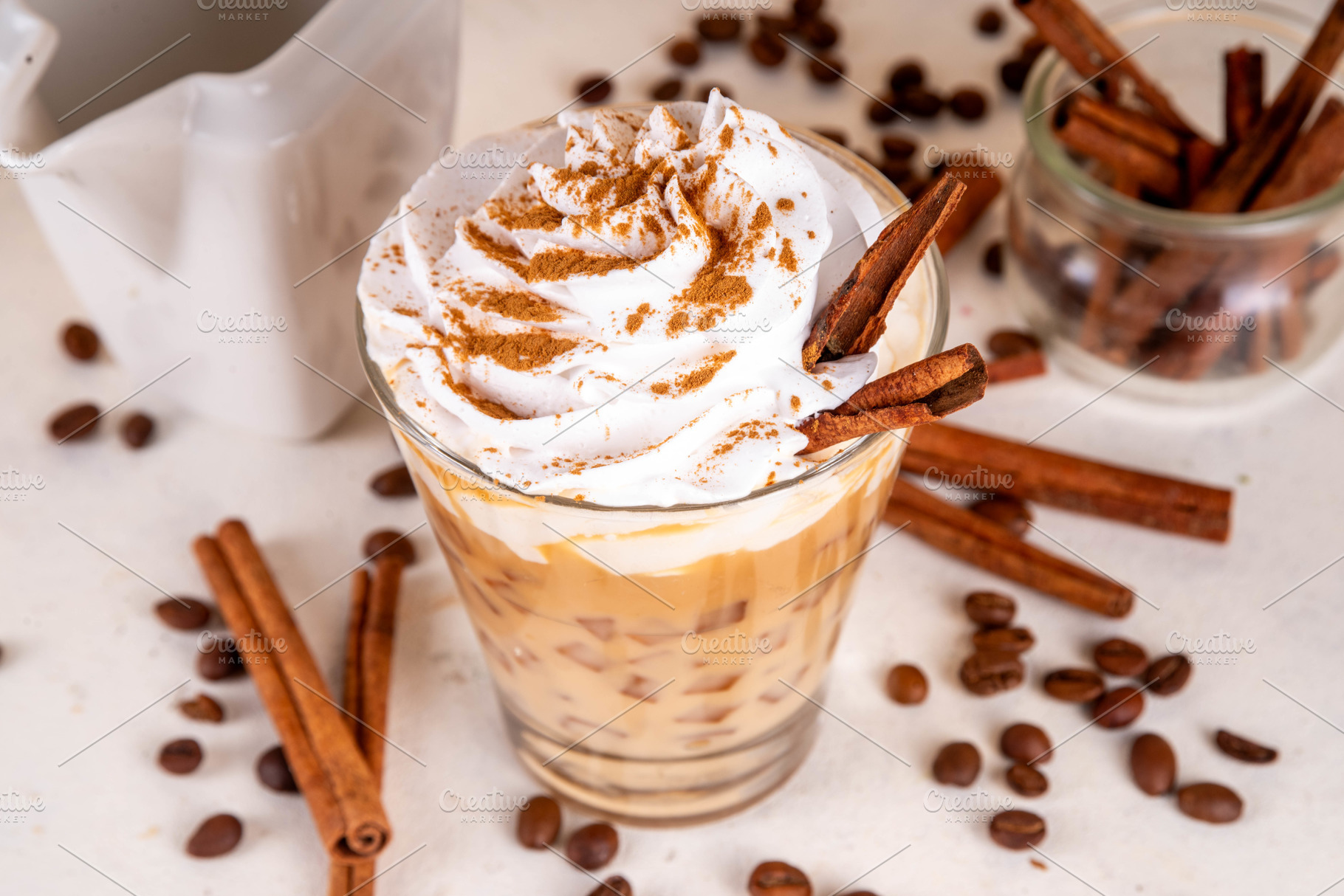 Iced cinnamon latte with whipped cream, a Food & Drink Photo by Rimma